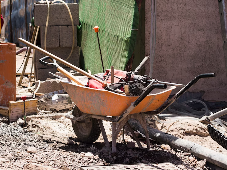 construction-site-with-barrow-filled-with-tools_23-2148254079 construction-site-with-barrow-filled-with-tools_23-2148254079