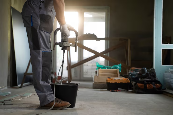tiler-working-renovation-apartment_23-2149278577 tiler-working-renovation-apartment_23-2149278577